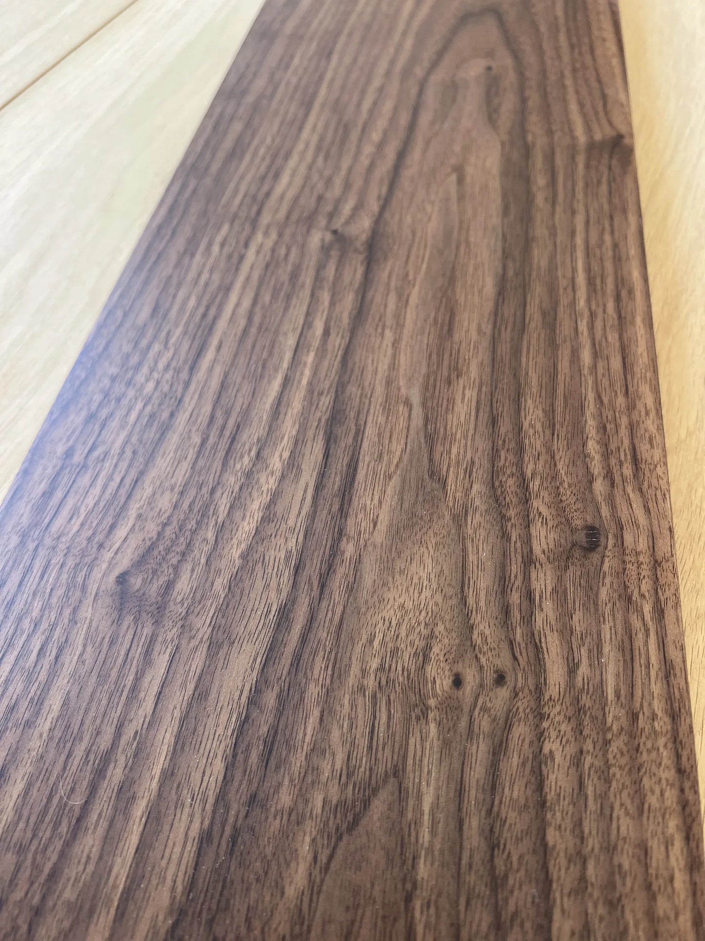 A close-up of walnut flooring wood grain surface