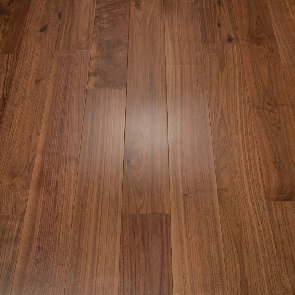 Walnut hardwood flooring planks with visible natural wood grain patterns and knots, arranged in a plank layout with a satin finish.