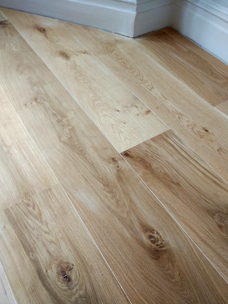 180mm Rustic Solid Oak Flooring installed in Lisbon, Portugal. Finish - Clear Laquer {satin]