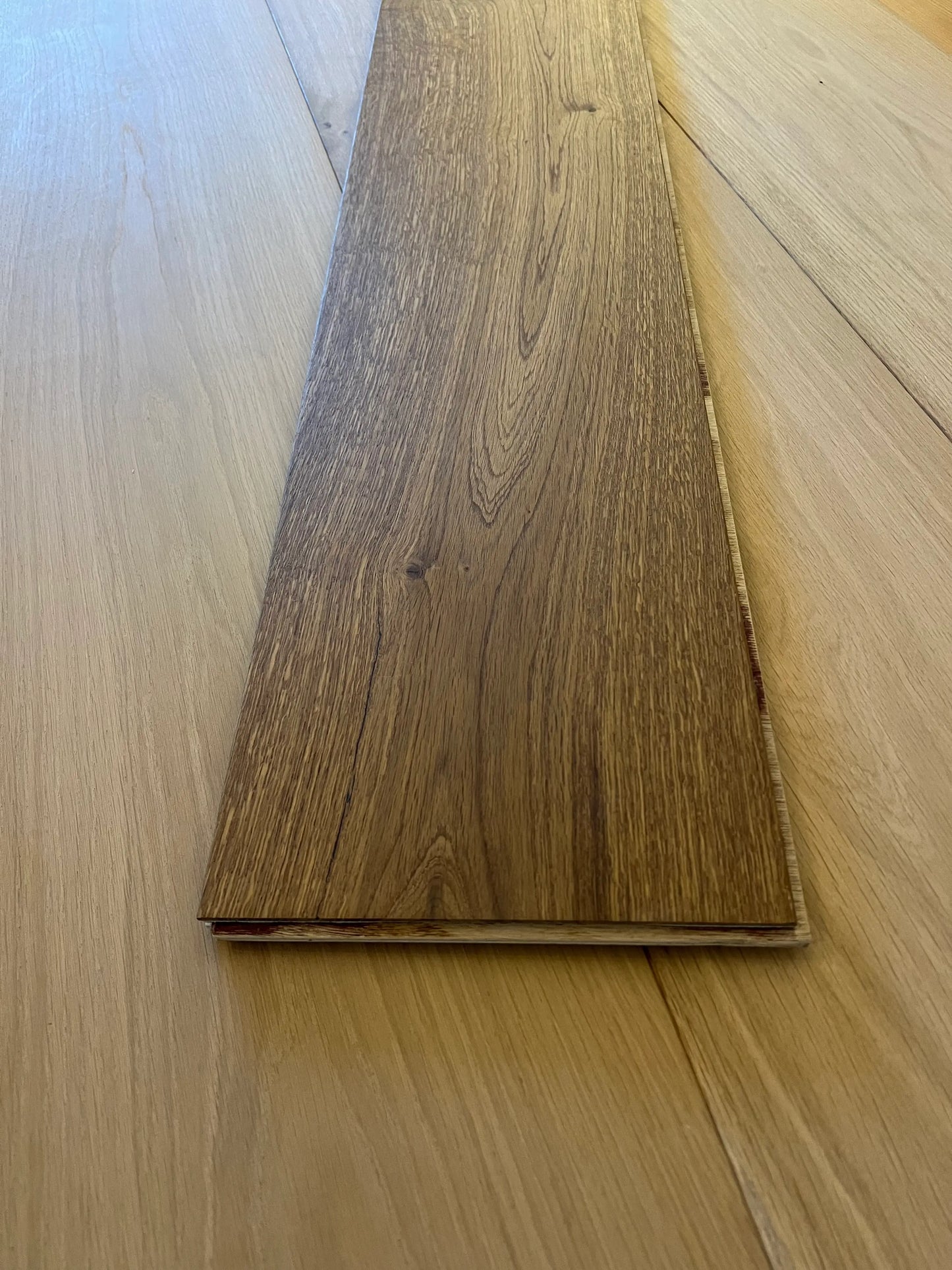 Smoked Wooden flooring sample with a visible grain pattern